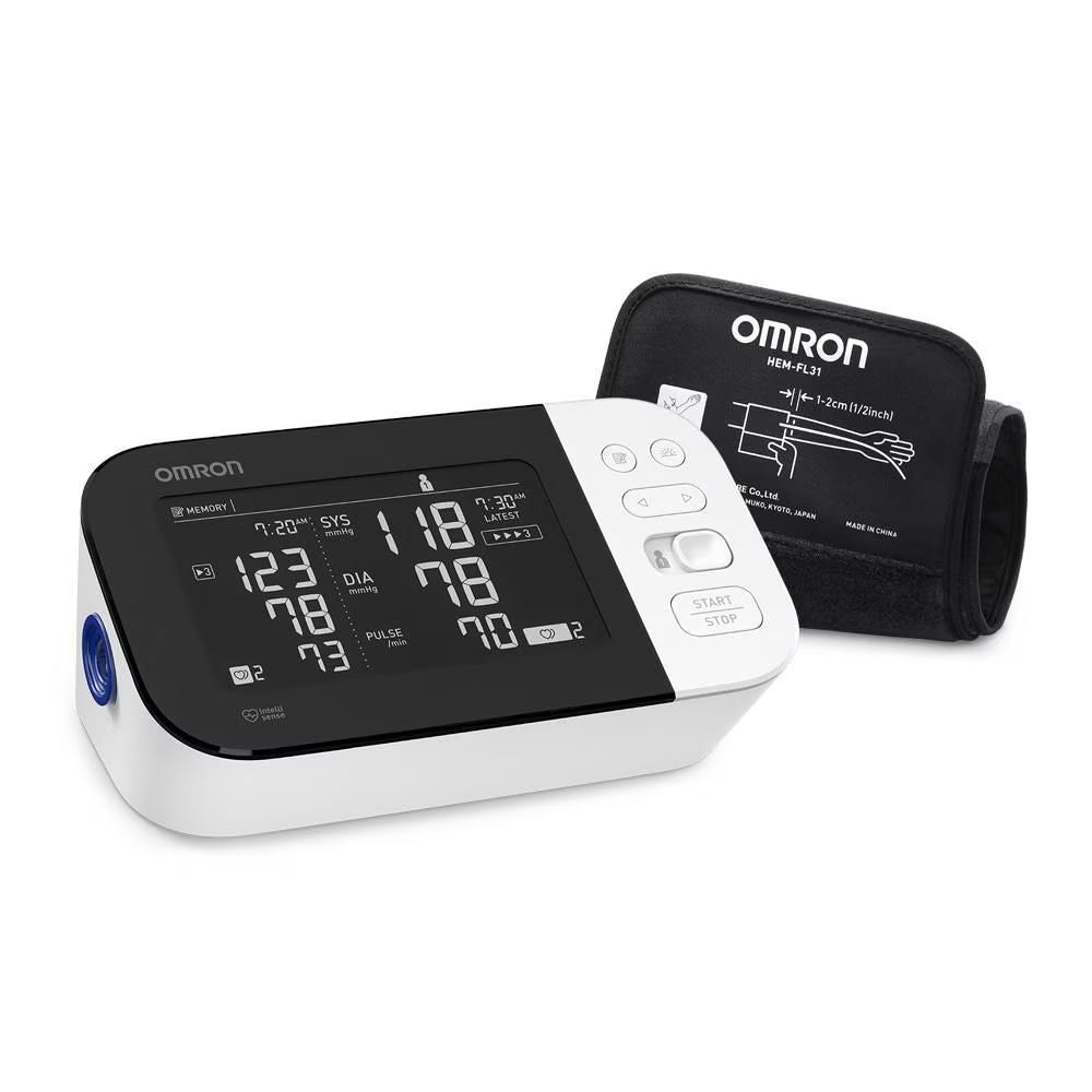 Omron blood pressure monitor with digital display on a white background