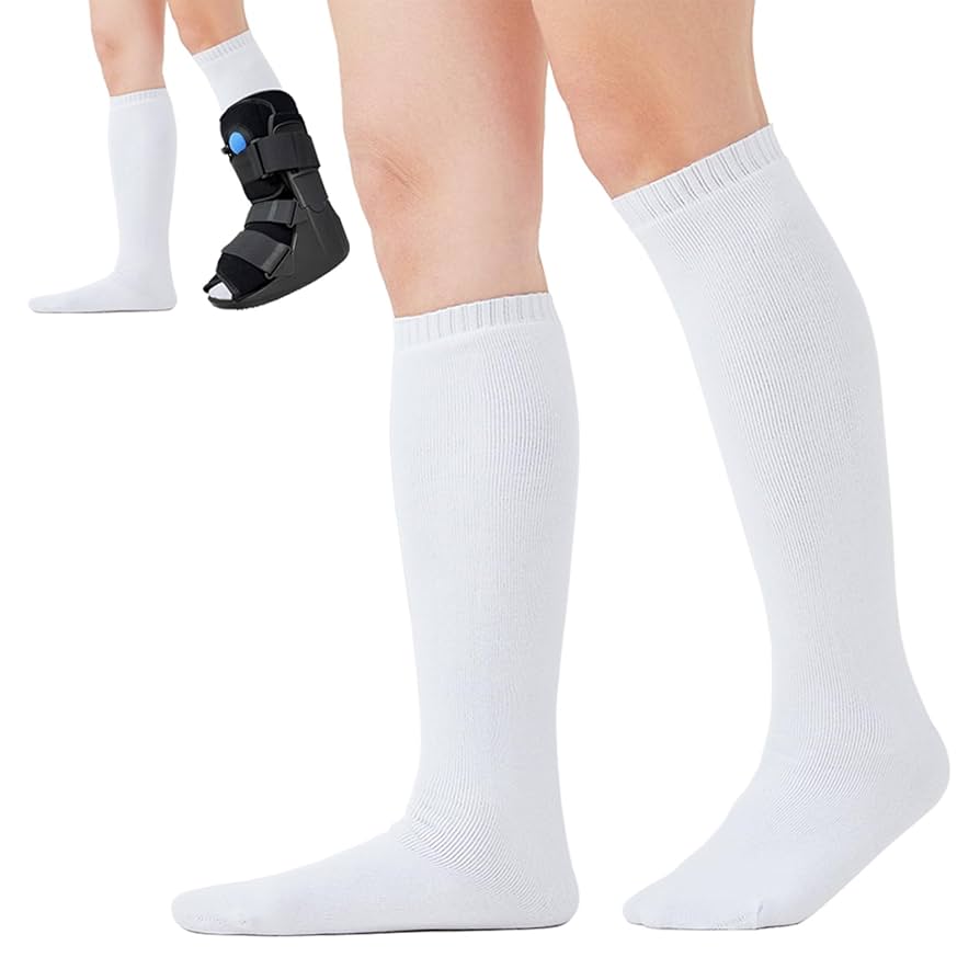 White knee-high socks worn with a black foot brace on a white background