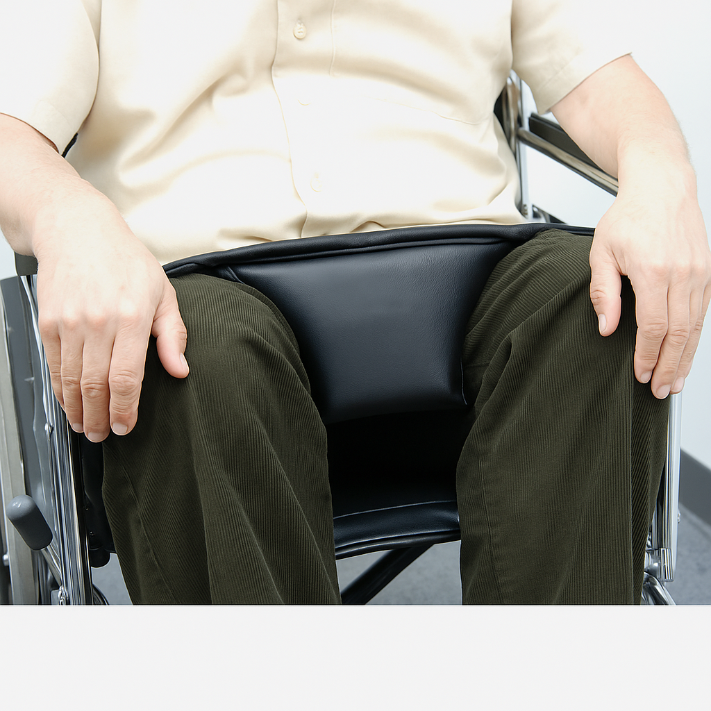 Person sitting in a wheelchair with a plain background