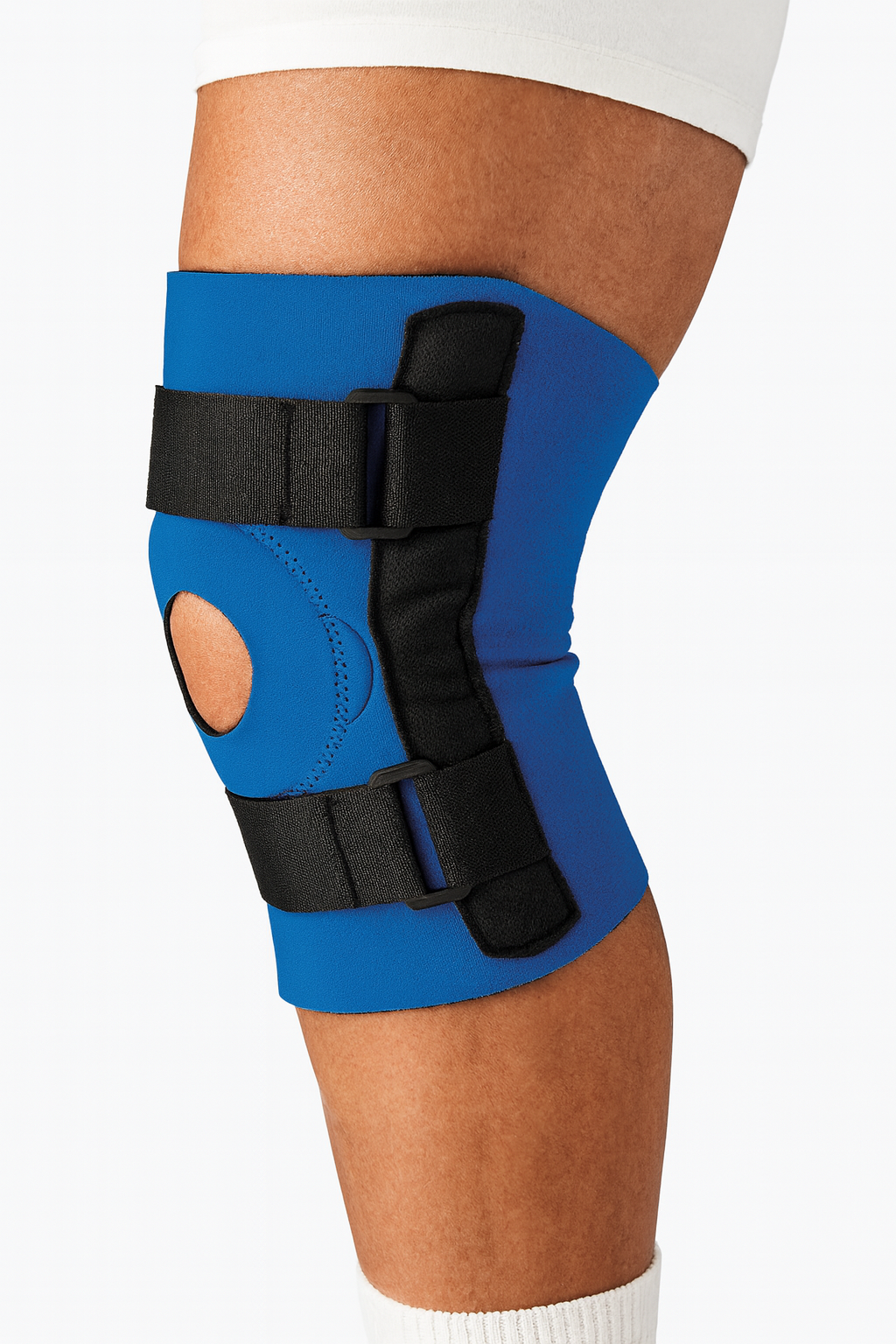 Blue knee brace with black straps on a person's knee