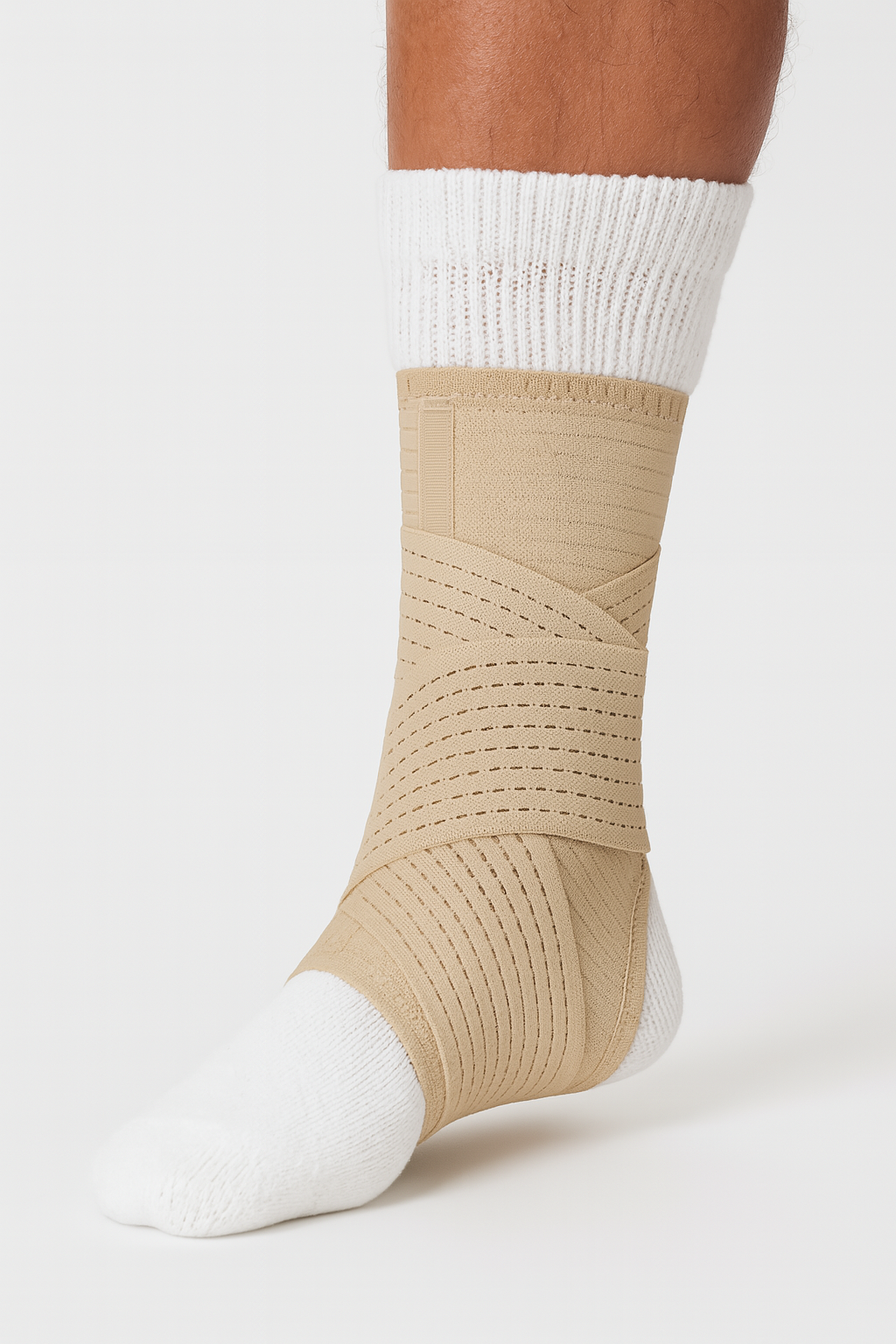 Beige compression sock worn over a white sock on a neutral background