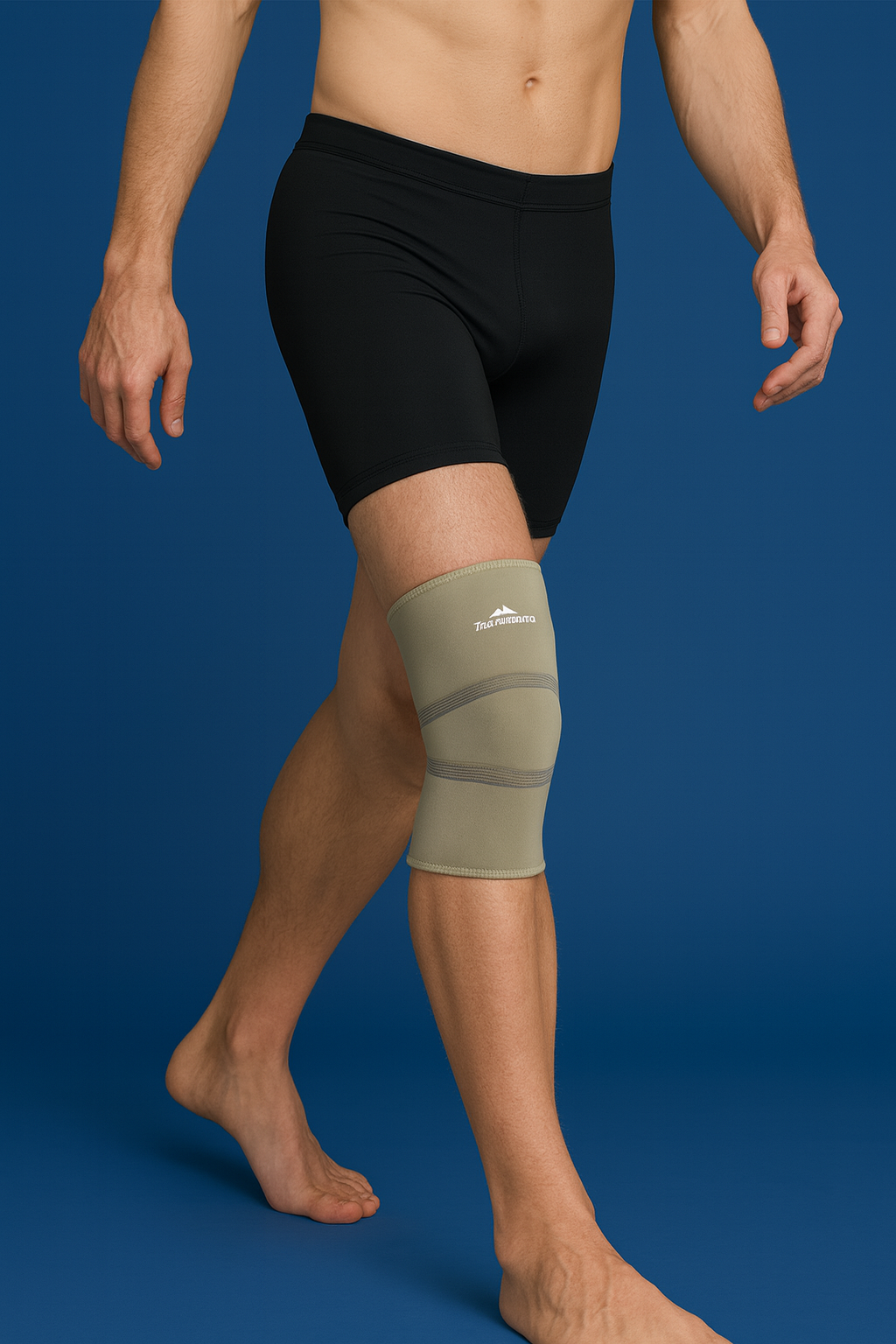 Person wearing a green knee brace on a blue background