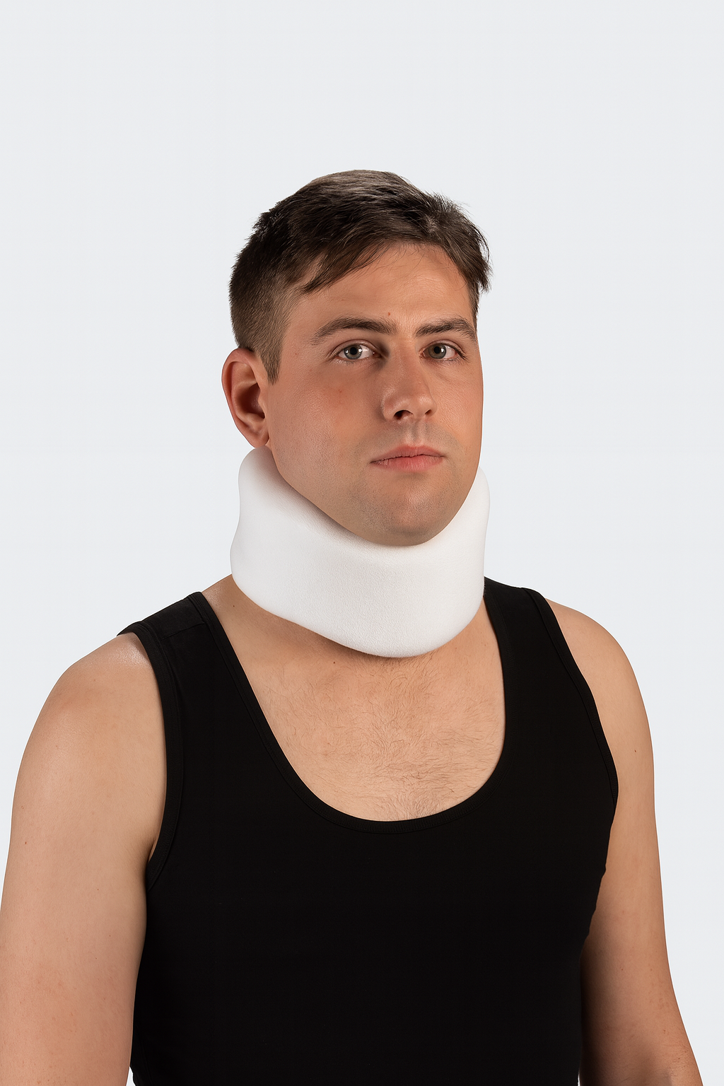 Man wearing a white neck brace against a white background