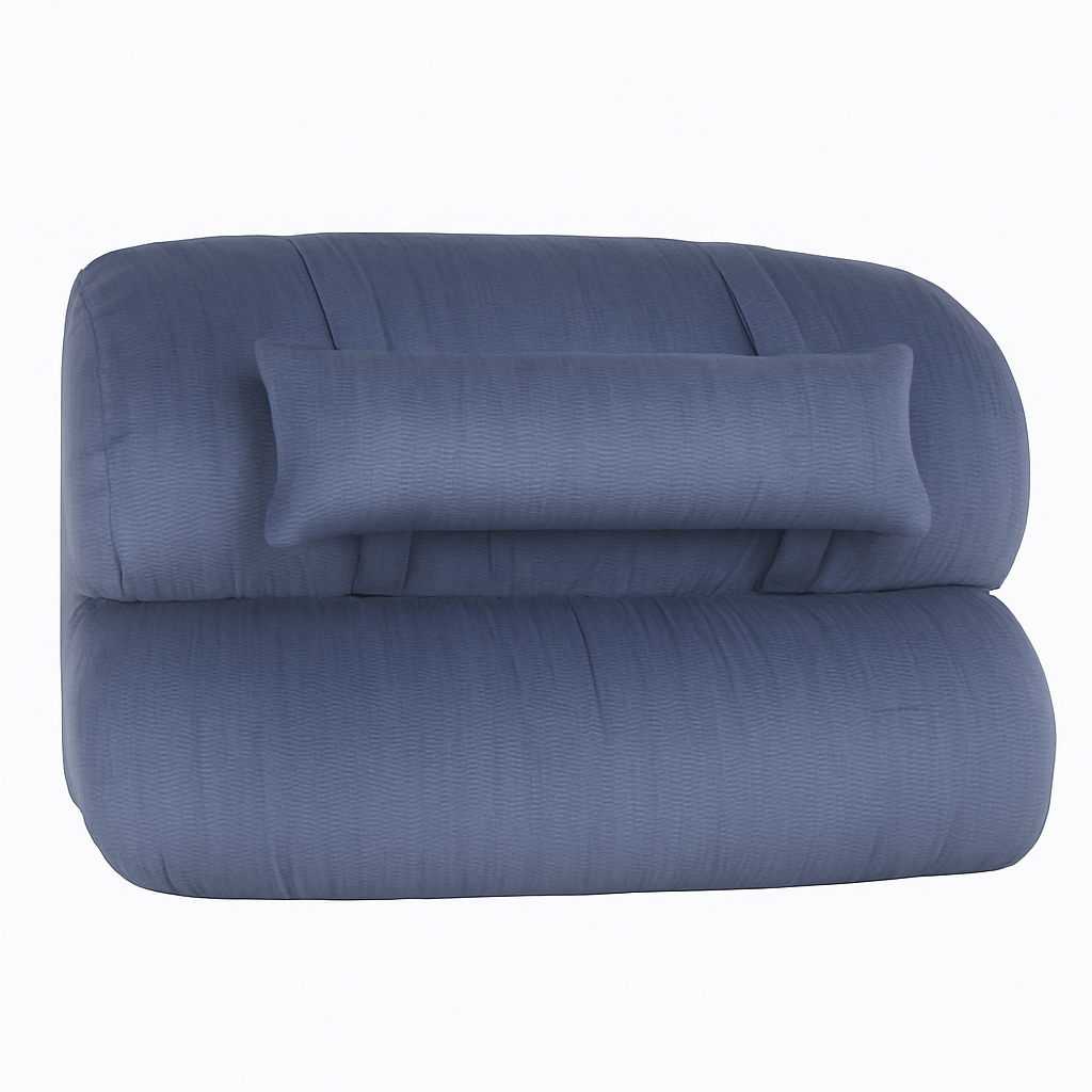Blue textured comforter with a matching pillow on a white background