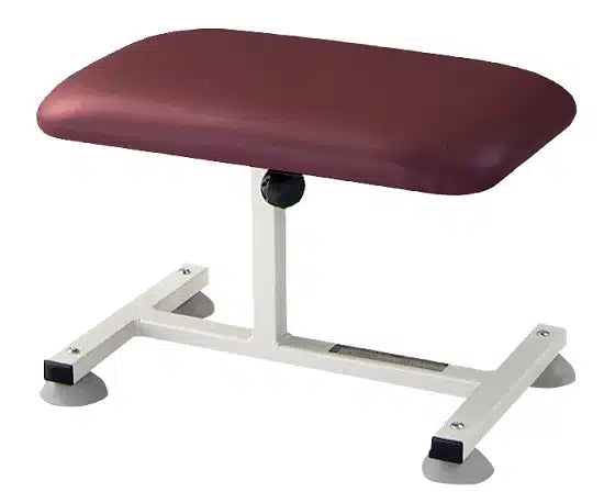 Maroon kneeling stool with white metal base on a white background