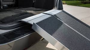 Truck bed with a folding ramp extended
